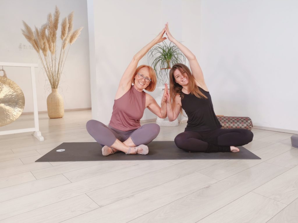 Two women in a yoga pose